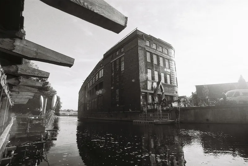 Am Flutgraben 3 — aerial view of the building and canal